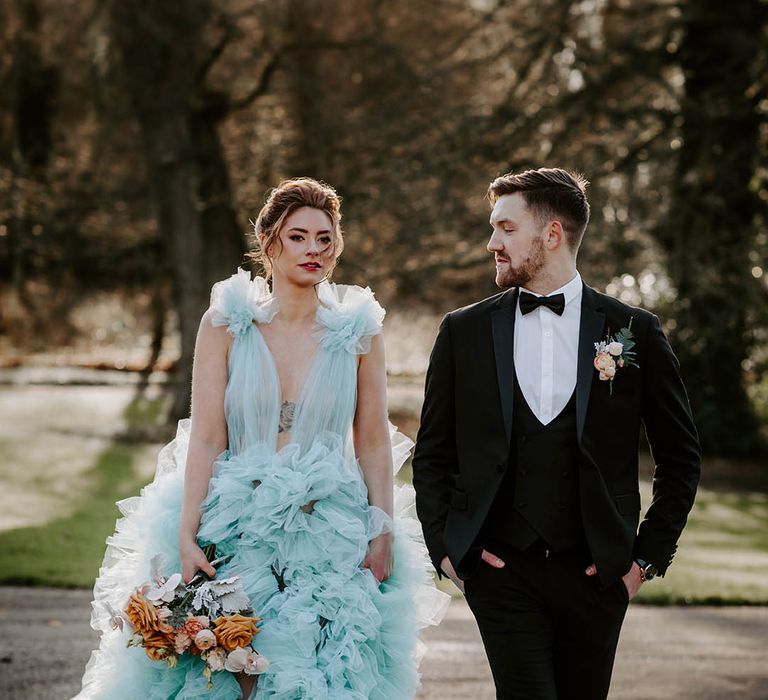 Newburgh Priory Marie Antoinette wedding inspiration with bride in a Millia London tulle wedding dress and groom in a tuxedo with horseshoe waistcoat 