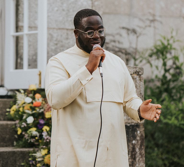 Wedding guest reads out his speech for country house wedding 