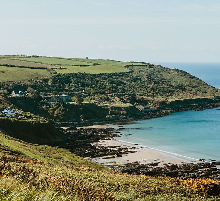 Beach front for Cornwall wedding with pink starry wedding dress and DIY aspects throughout