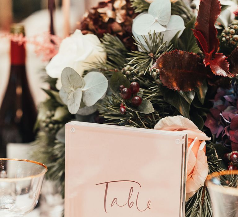 Blush pink and burgundy wedding table sign made to match the festive wintery colour palette 