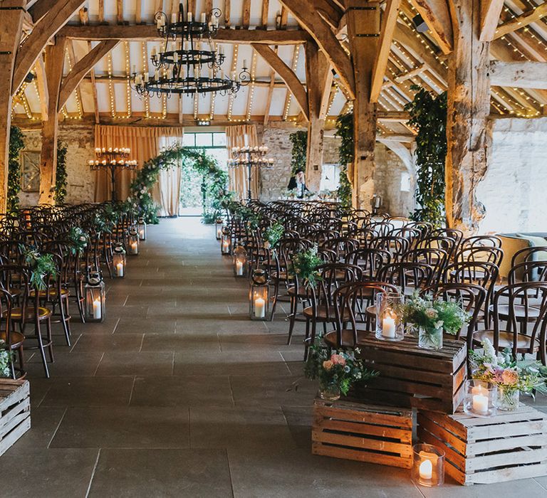 The Tithe Barn Bolton Abbey, Yorkshire wedding ceremony flowers and candle decor 