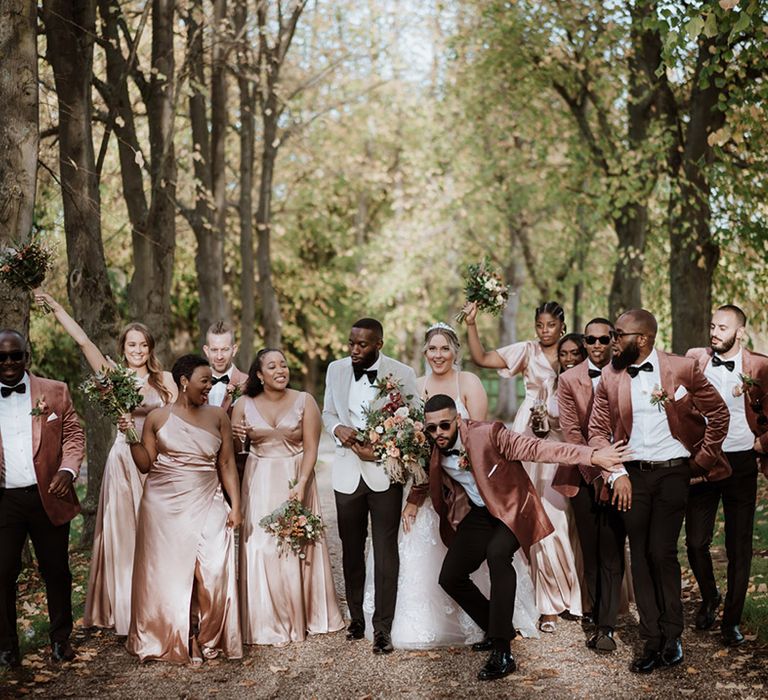 Blush pink wedding outfits worn by the intimate wedding party to match the terracotta and blush pink wedding theme 