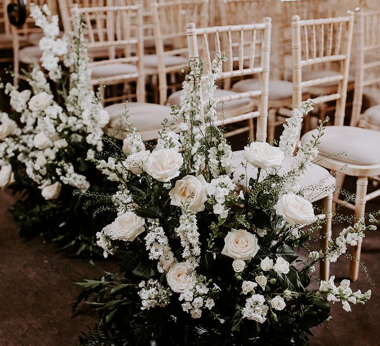 Aisle flowers with white wedding flowers for meadow botanical vibe 