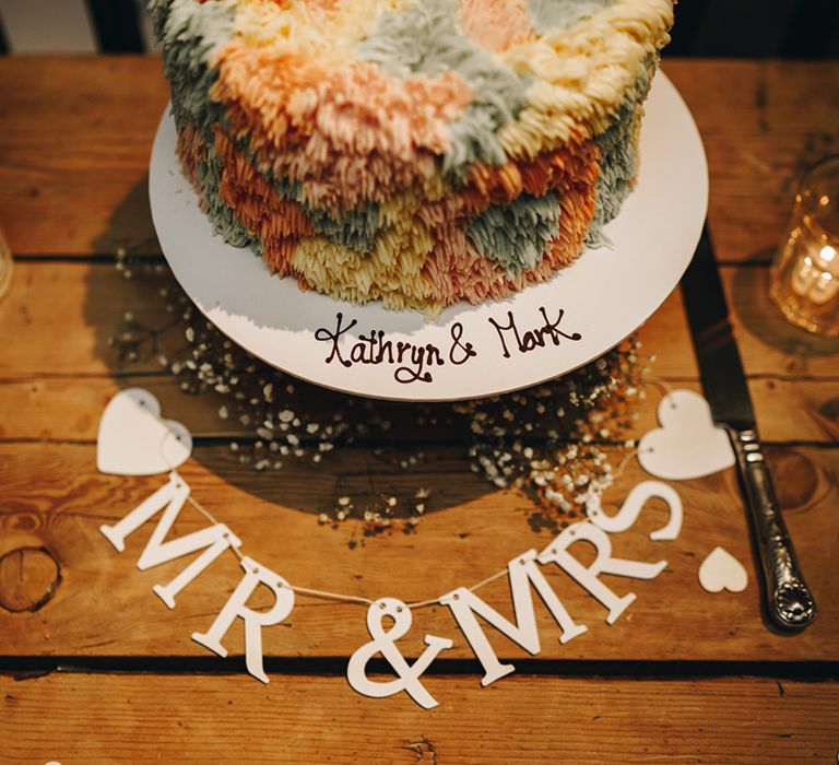 Rug wedding cake with colourful icing personalised name 