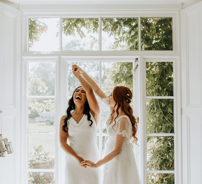 Brides at same sex wedding with unique outdoor wedding 