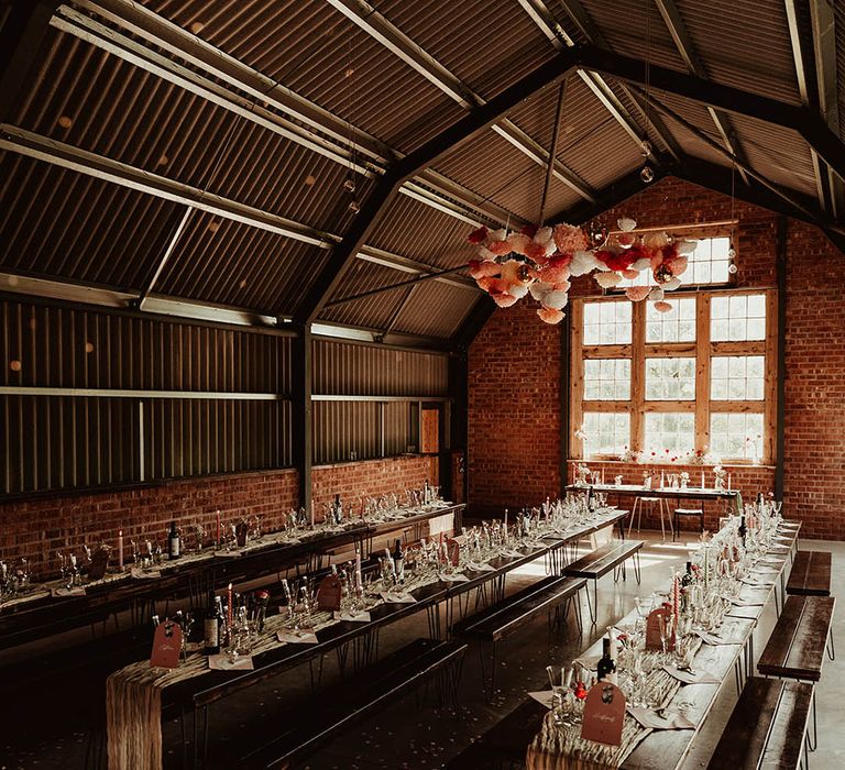 Industrial wedding venue in Wales with pink theme wedding decor 