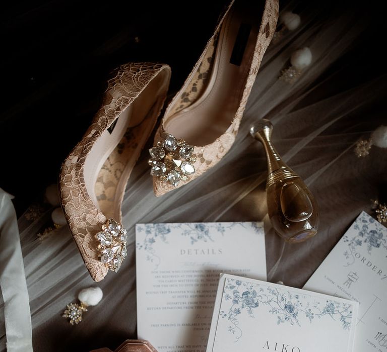 Blue and white wedding stationery with bridal accessories including Dolce & Gabanna wedding shoes