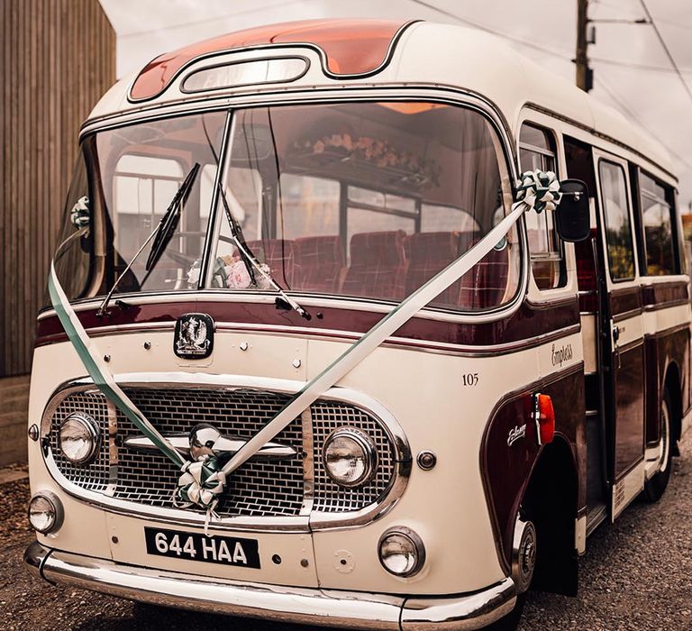 Wedding transport bus decorated with white ribbon 