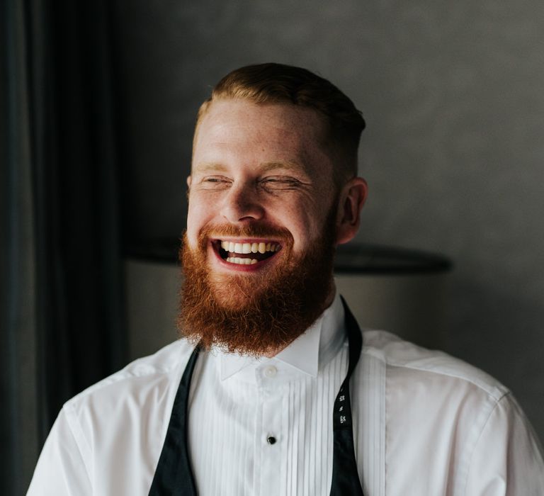 Bearded groom on wedding morning