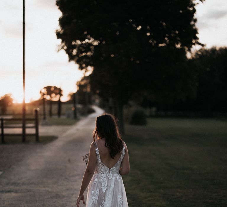 golden hour portrait with bride in lace Madi Lane wedding dress 