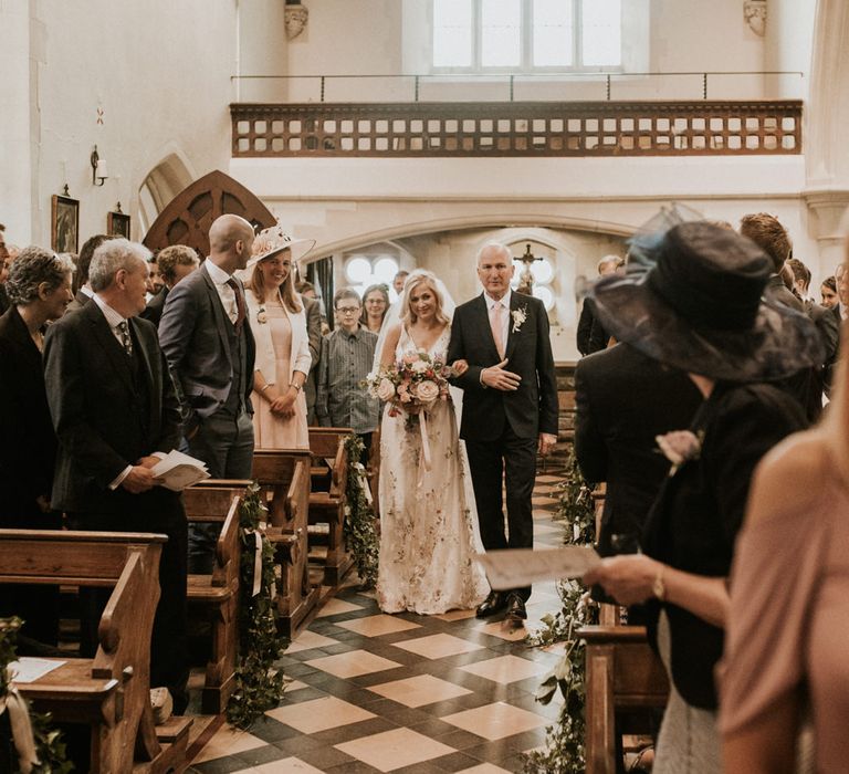 Church wedding ceremony bridal entrance in floral embroidered wedding dress