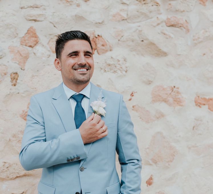 Groom in blue wedding suit