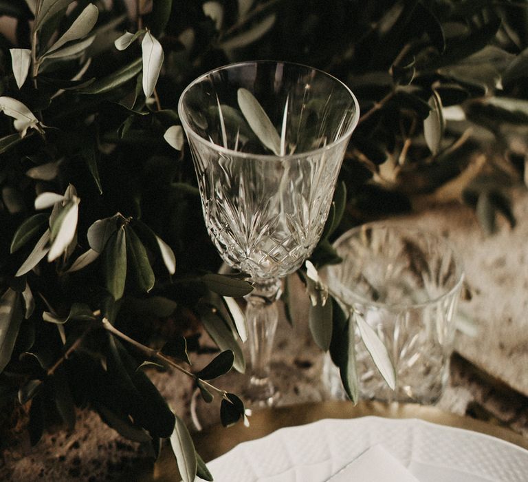 Crystal cut wine glass with olive branches