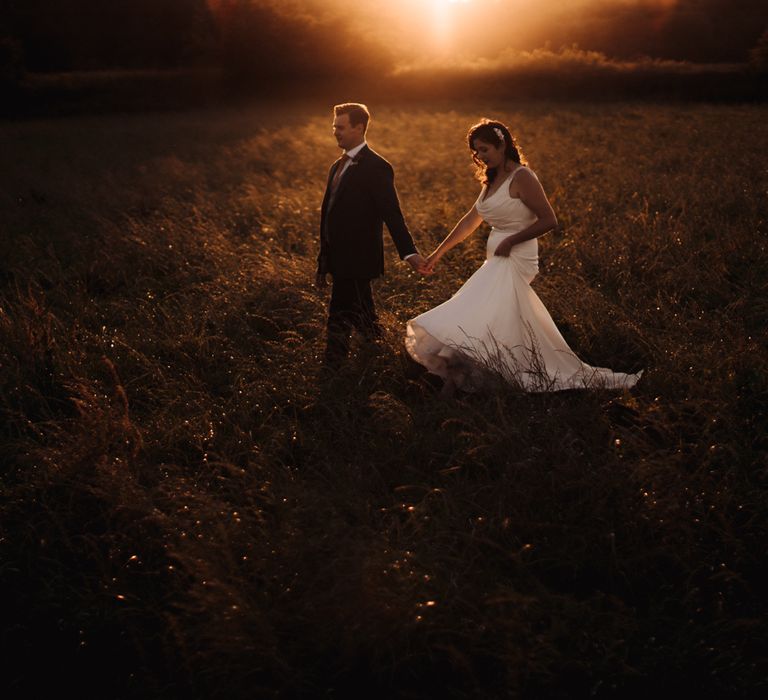 Golden hour photo in the countryside of Bride & Groom