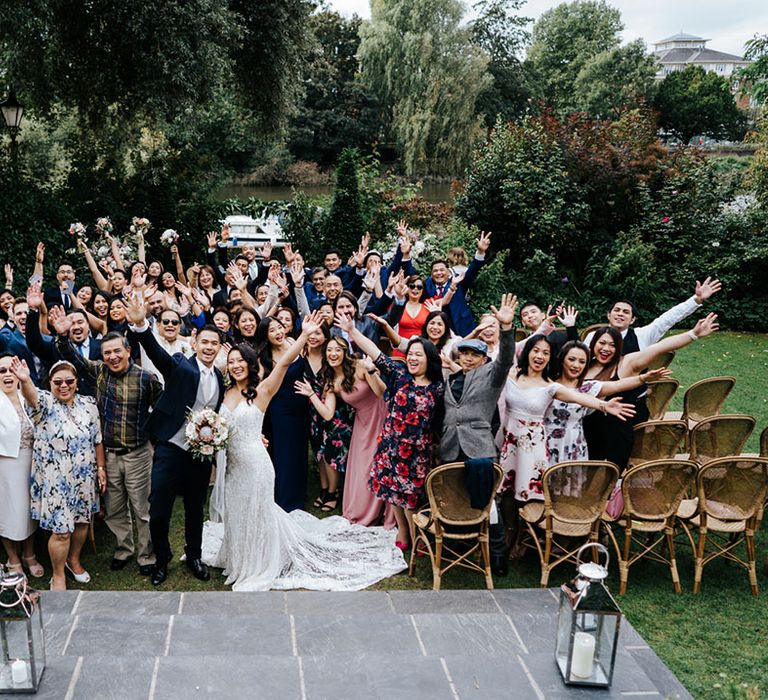 Wedding guests and the happy couple all smiling at Bingham Riverhouse Wedding 