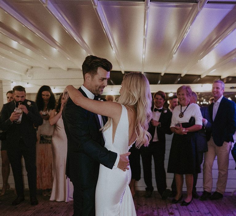 Guests watch on during bride and groom's first dance