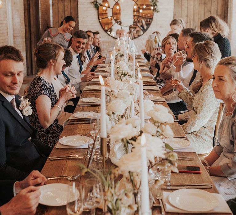 Wedding guests sit down and socialise for the wedding breakfast 