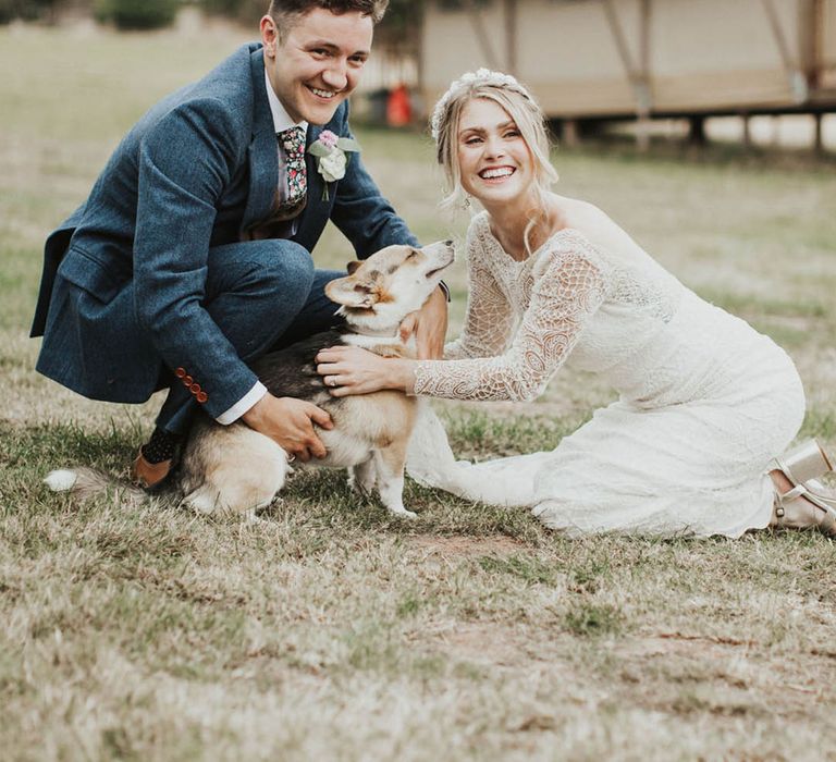 Bride and groom show some love to their pet corgi and flower girl 