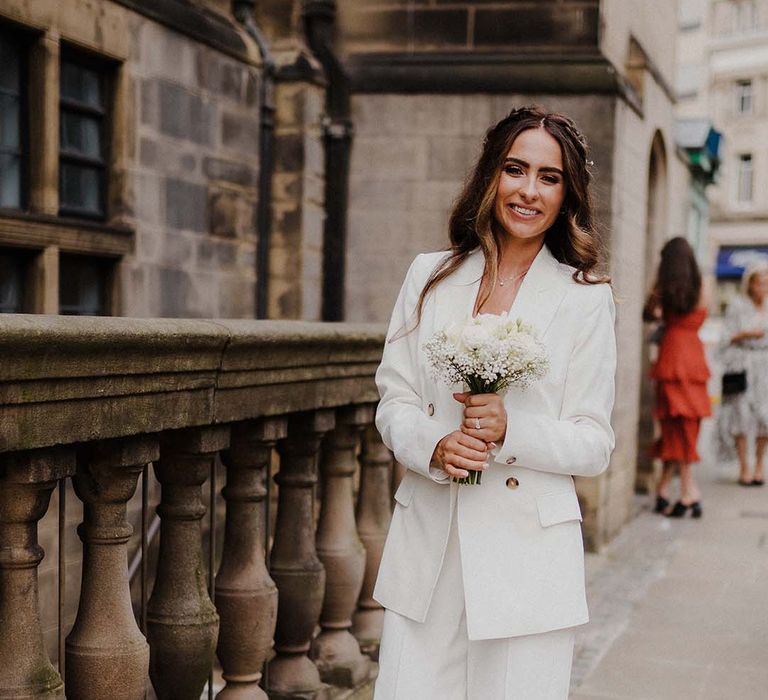 Bride in a white trouser suit at Sheffield registry office wedding