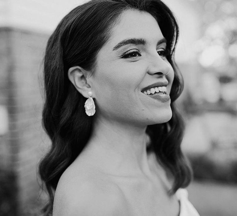 Bride with pearl earrings with brunette hair in Hollywood waves