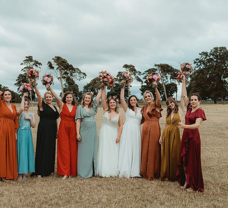 Brides with their bridesmaids in mismatched bridesmaid dresses 