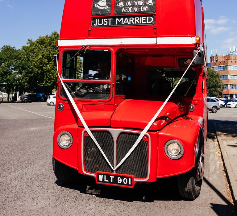 London bus wedding transport with white ribbon and "just married" sign