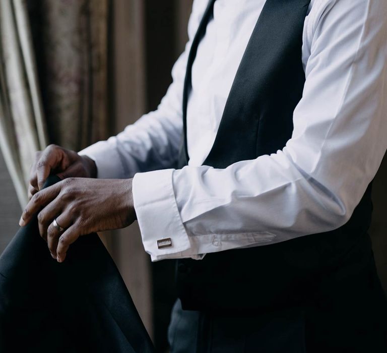 Groom getting ready in black tie classic tuxedo before elegant Manor House wedding at Yorkshire wedding venue 