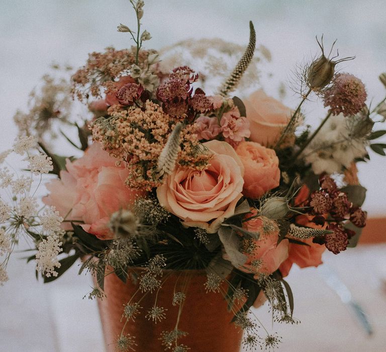 Potted flower arrangement with pink roses and pink peonies for outdoor wedding at Lila's Wood 