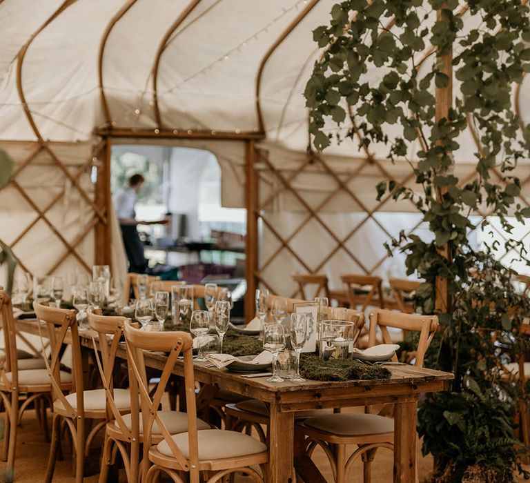 Moss wedding table runner with white tea lights and foliage decor yurt wedding reception 