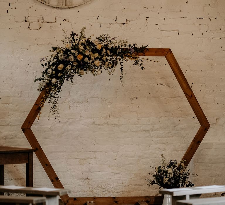 wooden hexagonal frame altar wedding decor with flowers 