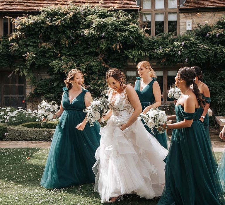 Bridal party in lace tulle and green dresses