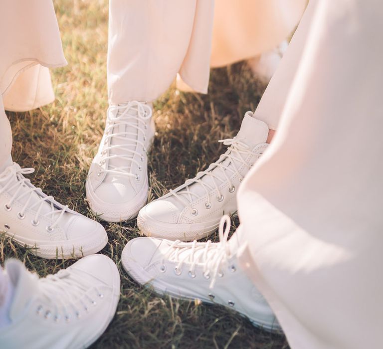 Bridesmaid in white high top trainers