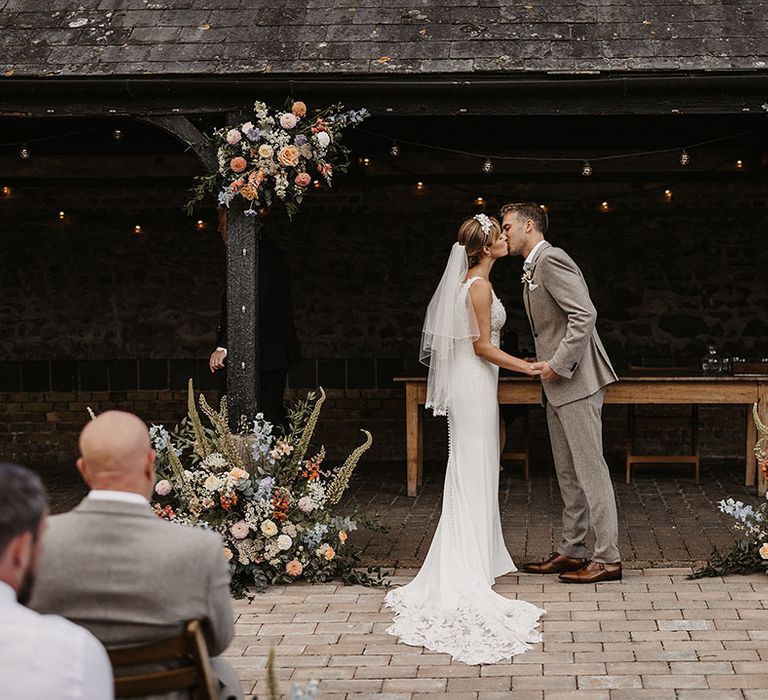 Elmley Nature wedding venue decorated with a plush green velvet sofa and pastel wedding 