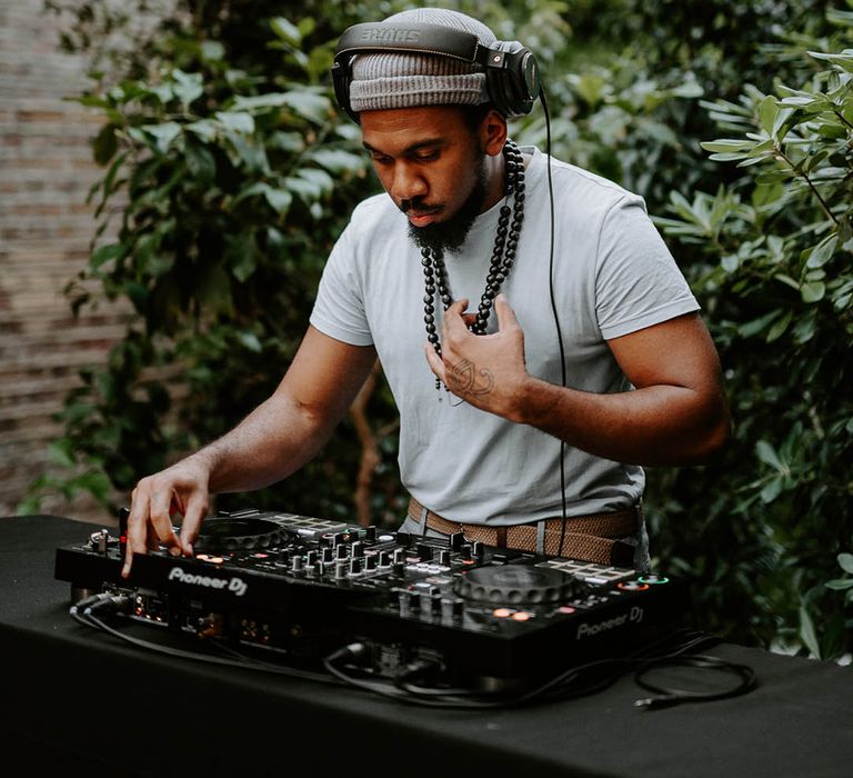 Wedding DJ plays at the wedding welcome drinks 