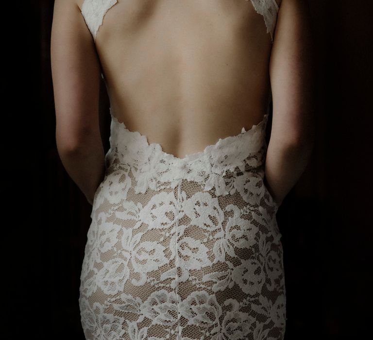 Bride wearing open back lace wedding dress from Grace Loves Lace 