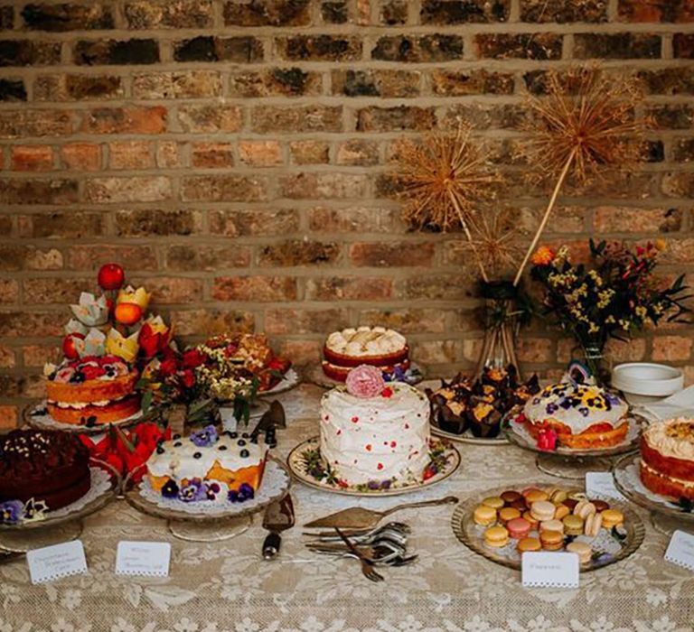 Wedding dessert tables with homemade wedding cakes including red velvet cakes, chocolate cake, macarons and more 