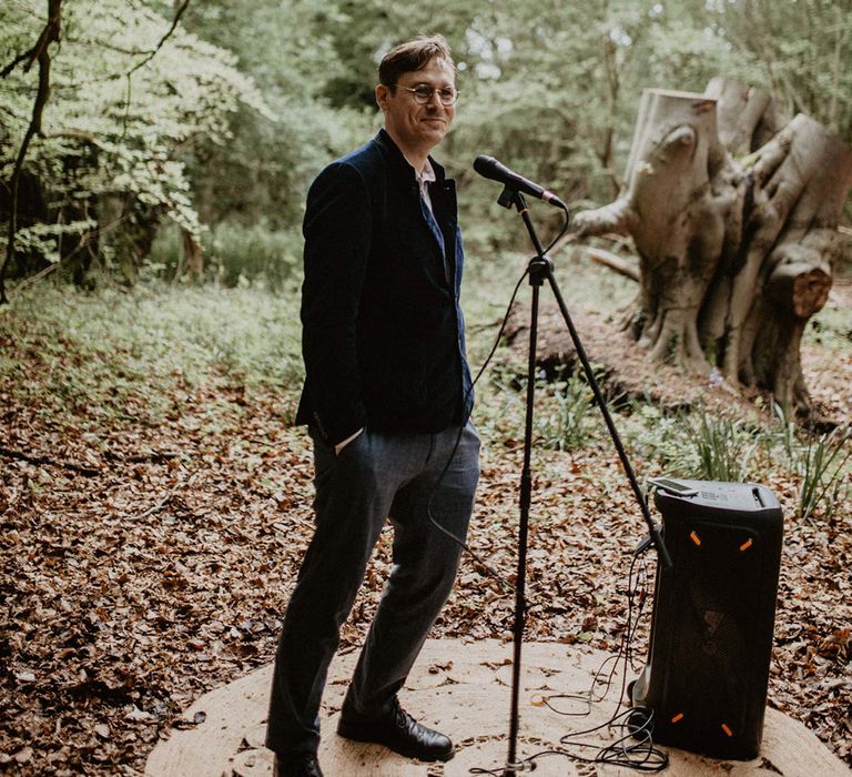 The bride's brother sings and performs a song at the wedding ceremony 