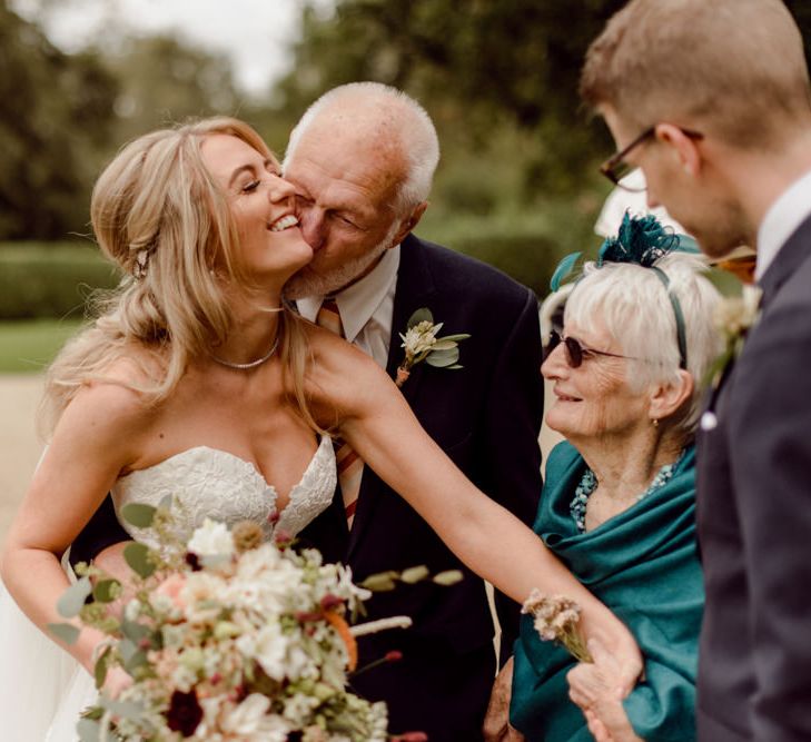 Bride shares a moment with a couple of special guests