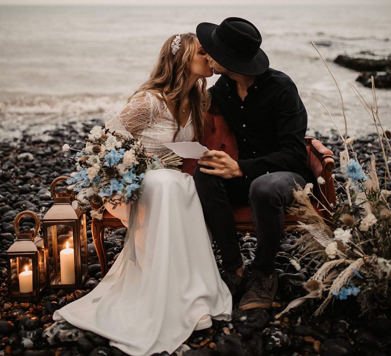 Bride and groom kissing on the beach 