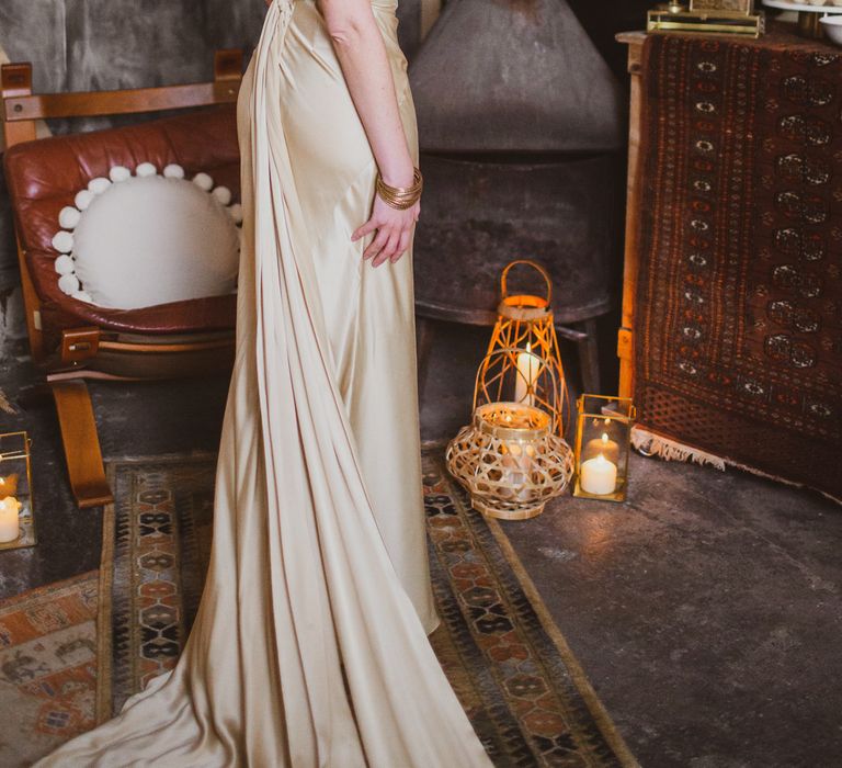 Bride in long gold wedding dress