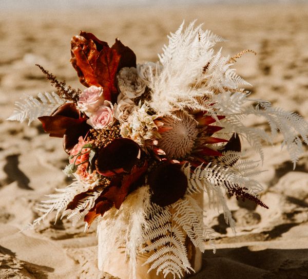 Wedding floral decor with pink roses and white ferns