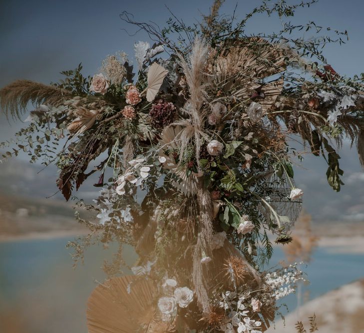 Dried flowers and palm leaves were used for the wedding altar