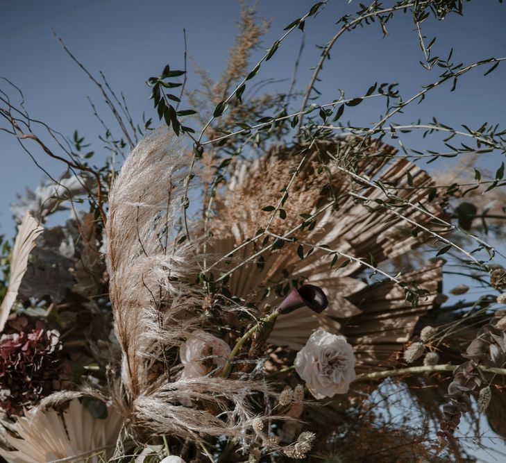 Beautiful pampas grass bouquet with dried flowers at same-sex elopement