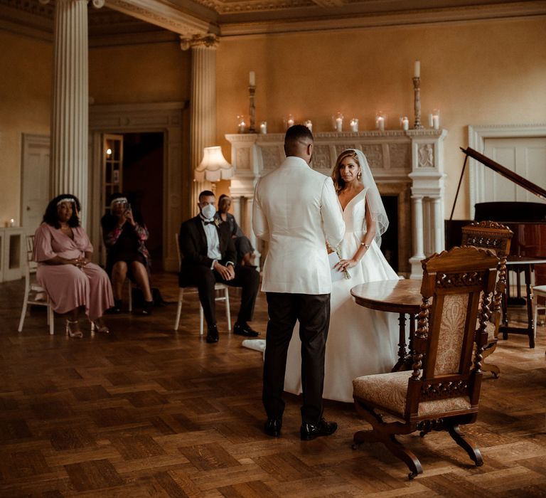 Intimate wedding ceremony at Hampton Court House wedding venue 