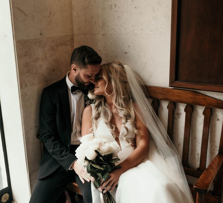 Bride & groom kiss after wedding ceremony