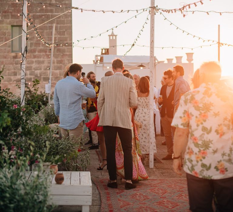 Guests at sunset on the first day of the wedding celebrations at Masseria Potenti