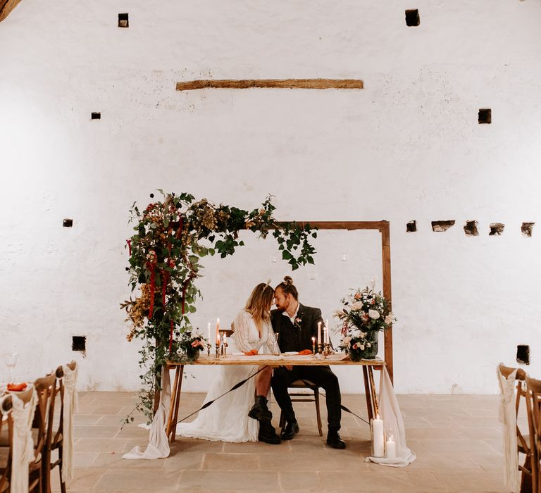 Sweetheart table for bride and groom at boho wedding inspiration