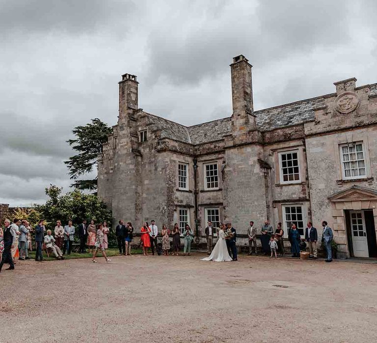 Guests gather at Cadhay House country house in Devon