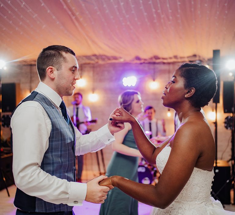 Beautiful Groom & Bride dance at wedding reception 