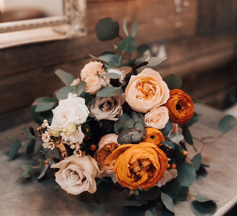 Orange and white rose and peony wedding bouquet for autumn rustic wedding 